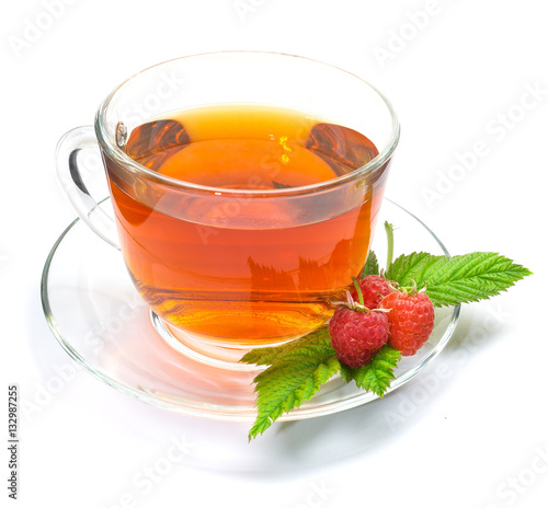 Cup of tea with raspberry isolated photo