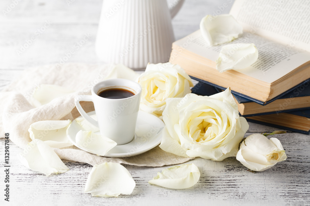 Chain drinking hot coffee on a wooden floor with beautiful roses