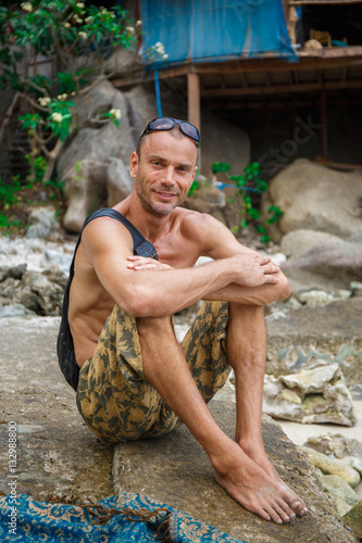 Handsone man on the beach photo