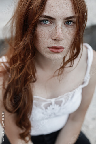 Beautiful redhead girl with blue eyes