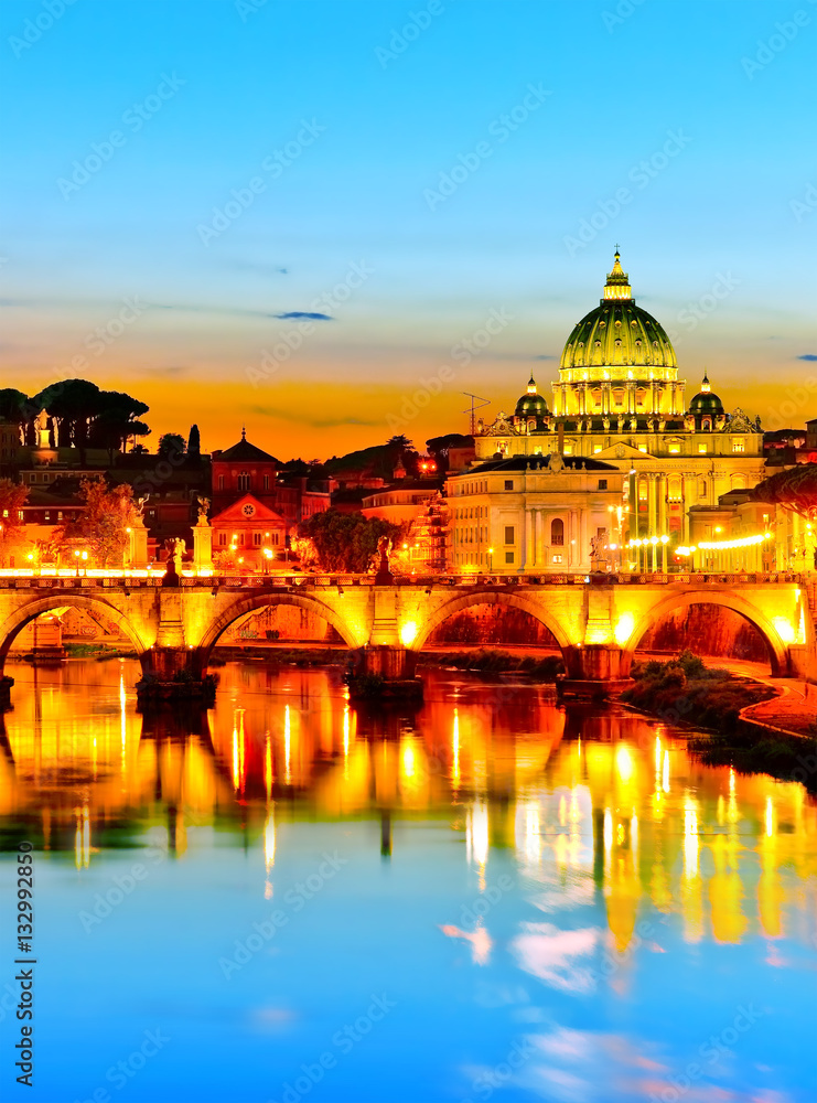 View of St. Peter's Basilica and Aelian Bridge at dusk in Rome 