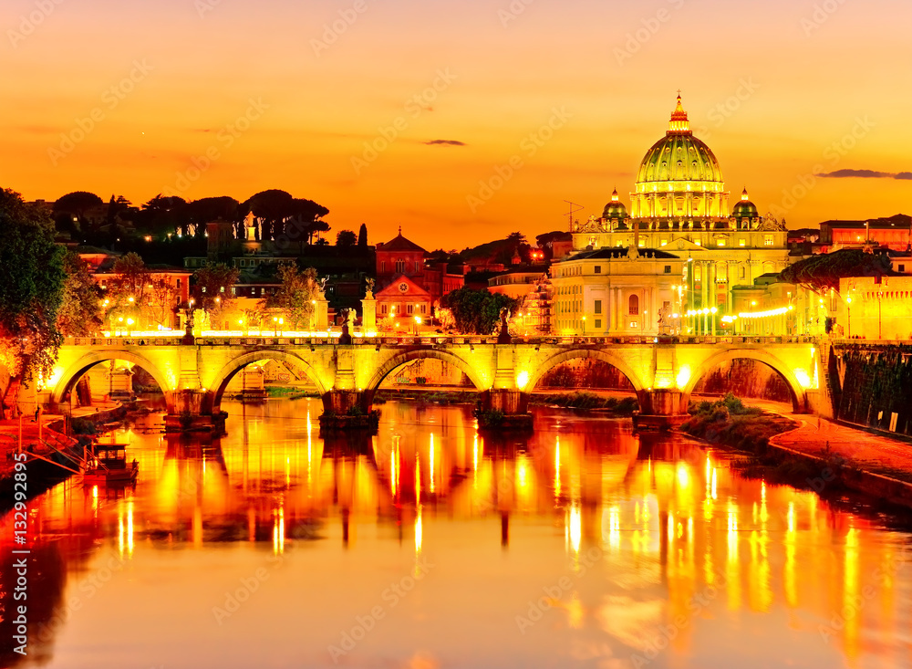 View of St. Peter's Basilica and Aelian Bridge at dusk in Rome 
