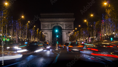 Champs Elysees in Paris illuminated for Christmas and Triumphal Arch in background © Bote