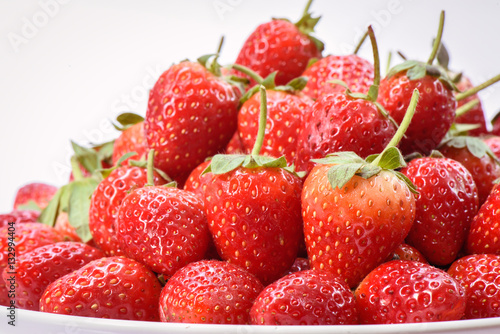 Group of Ripe strawberry organic on white plate