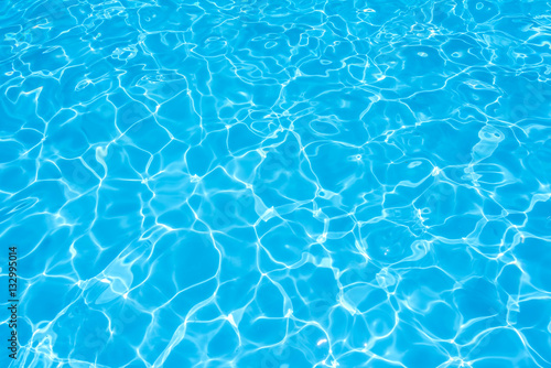 Blue and bright ripple water and surface in swimming pool