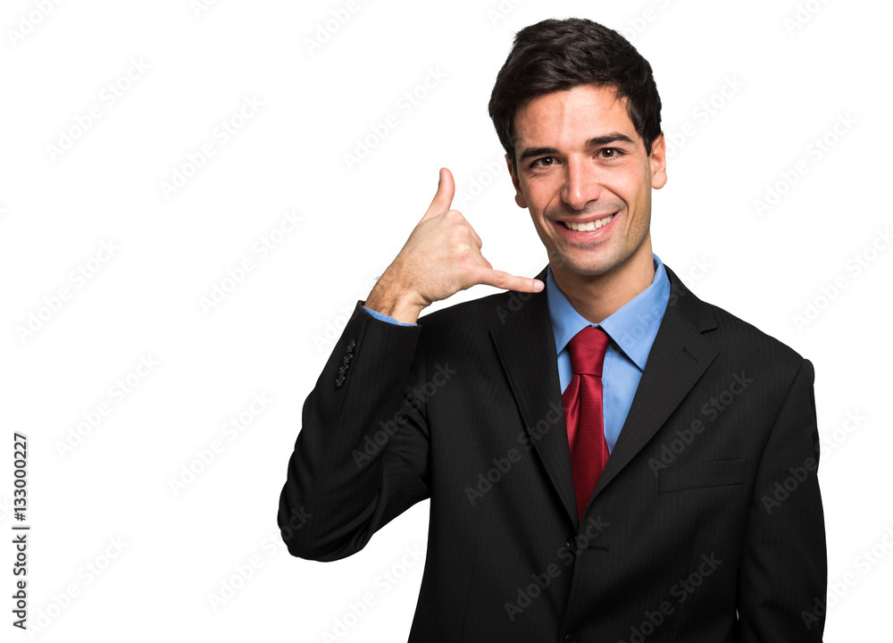 Businessman miming a phone with his hand
Businessman miming a phone with his hand