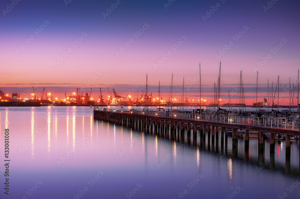 Getxo pier with yacht masts at night
