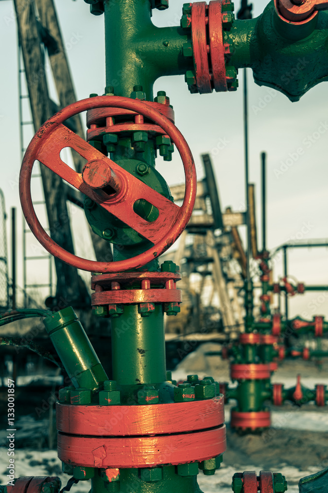Group of wellhead. Oilfield with sand ground. Oil and gas concept Group of wellhead. Oilfield with sand ground. Oil and gas concept