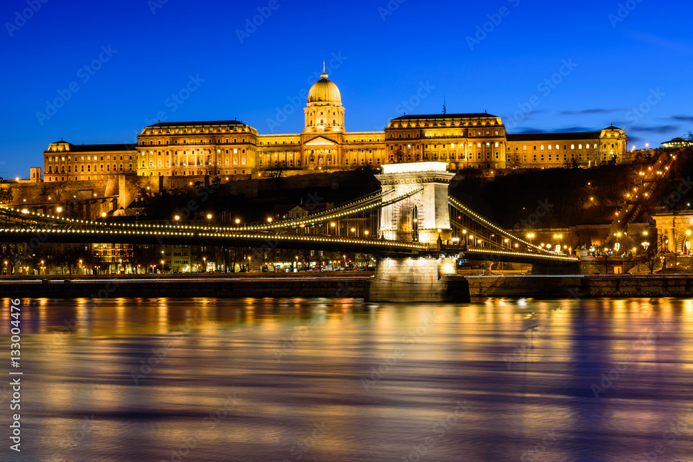 Hungarian landmarks, Chain Bridge, Royal Palace and Danube river in Budapest at night.