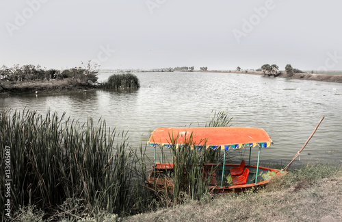 Colorful boat at lake bird sanctuaryin India