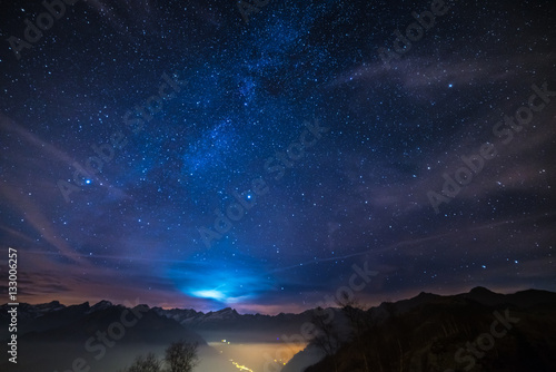 Night on the Alps under starry sky and moonlight