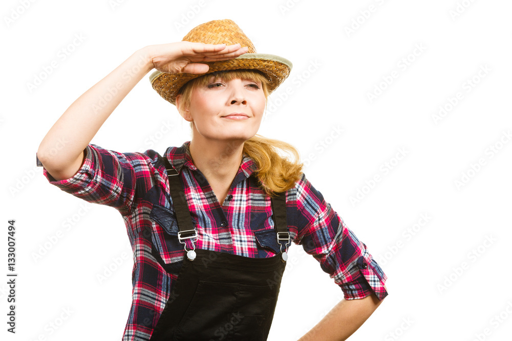 Woman wearing sun hat looking at something Woman wearing sun hat looking at something