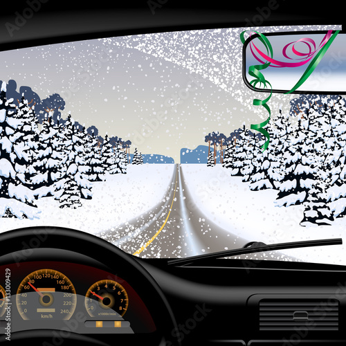 Winter road in snowfall from inside of the car