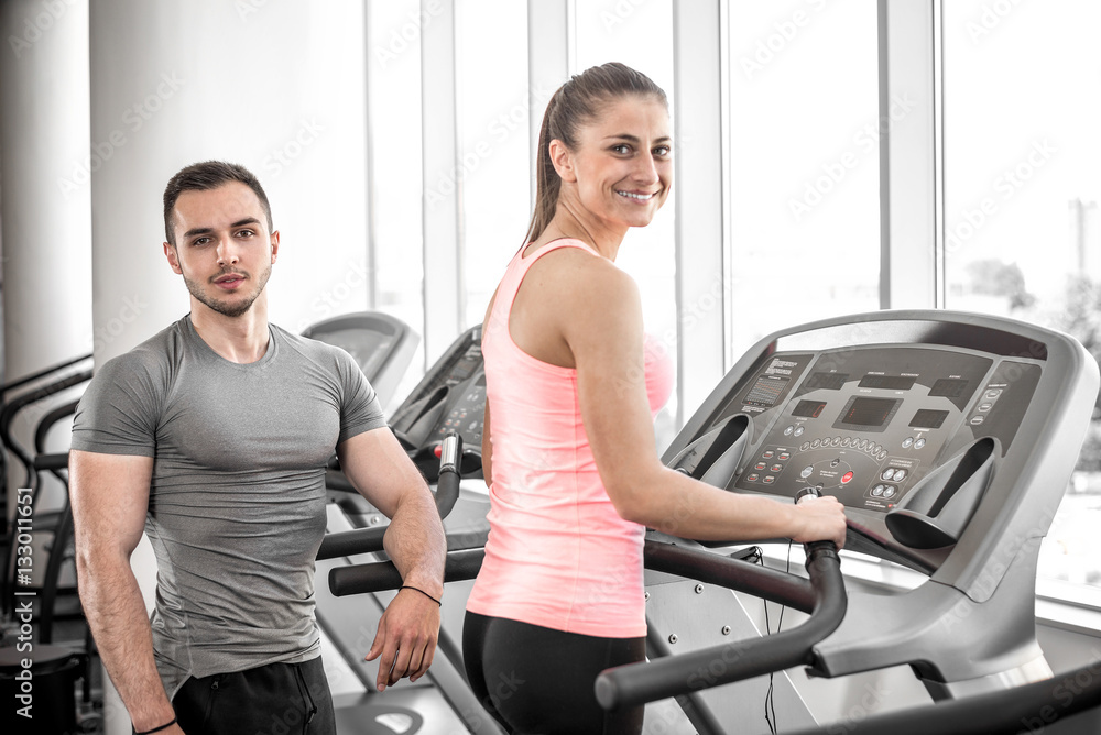 Treadmill walk with personal trainer. Treadmill walk with personal trainer.