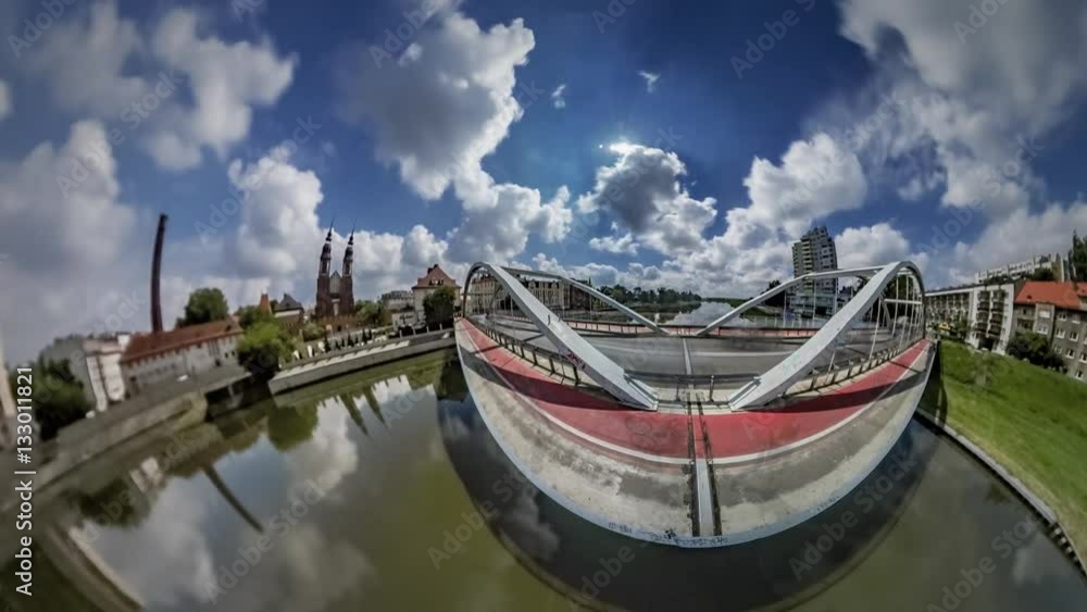 Little Tiny Planet 360 Degree Bridge Over Odra River in Opole With Red Bicycle Lane Cityscape in Sunny Day Time is Flying World is Changing Earth's Rotation Little Tiny Planet 360 Degree Bridge Over Odra River in Opole With Red Bicycle Lane Cityscape in Sunny Day Time is Flying World is Changing Earth's Rotation