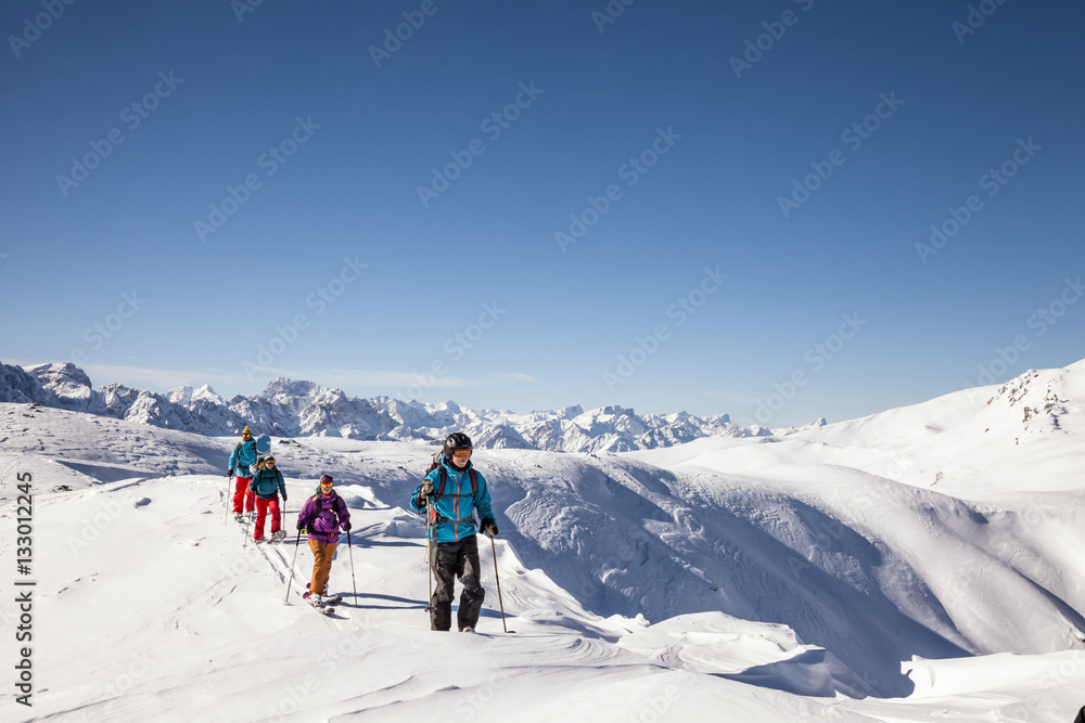 Group of skitourers walking in Sexten Dolomites Group of skitourers walking in Sexten Dolomites