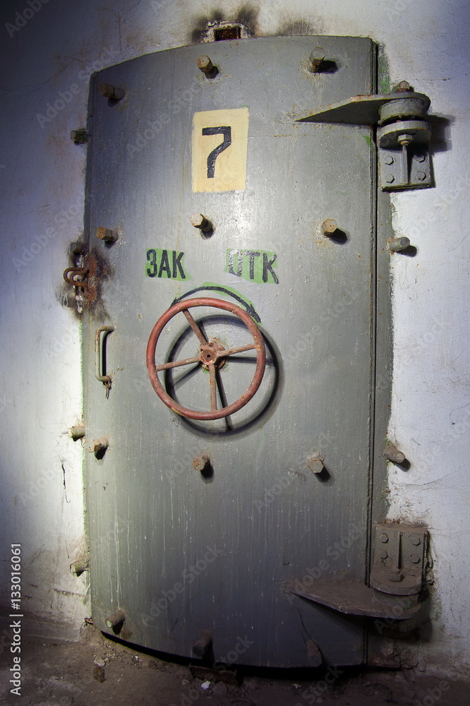 Hermetic door of an abandoned Soviet bomb shelter, an echo of the Cold War 