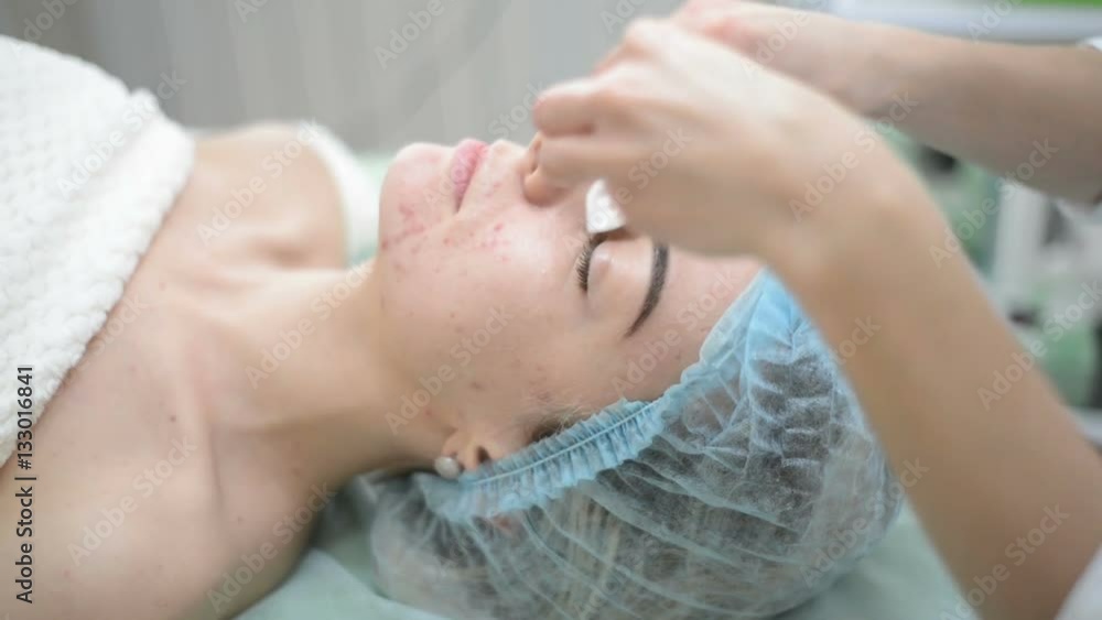 Woman receiving cleansing therapy Woman receiving cleansing therapy