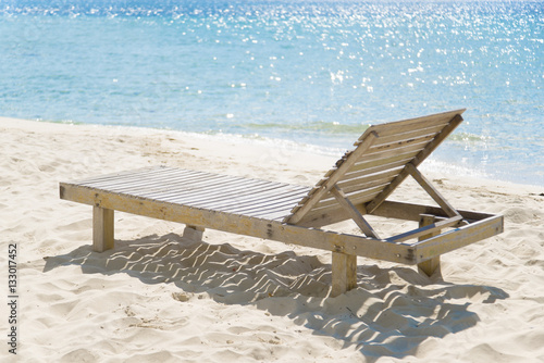 Simple chair at beach with bokeh background