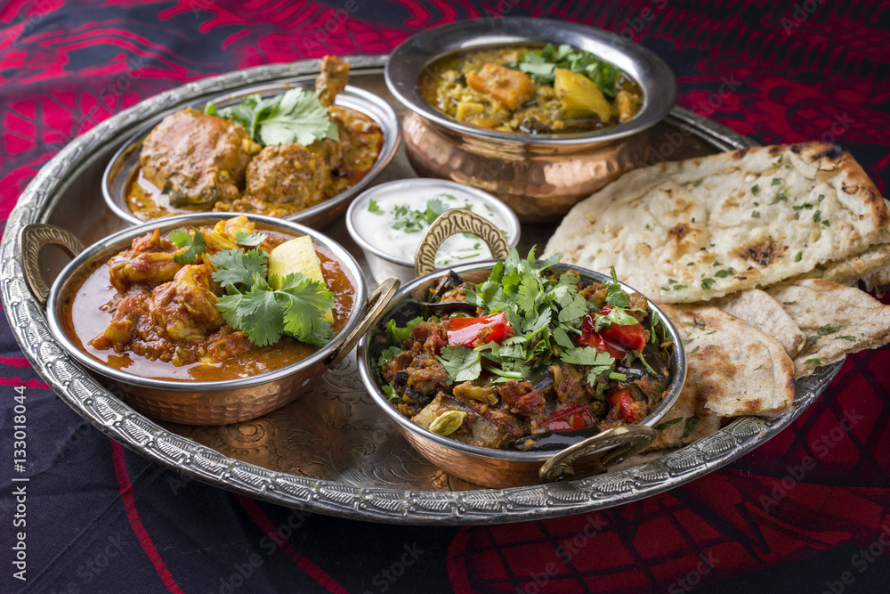 Traditional Indian Curry Dishes as close-up on Thali Traditional Indian Curry Dishes as close-up on Thali