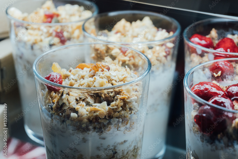 Εκτύπωση καμβά Granola with yogurt in glass cups, delicious homemade granola using glass