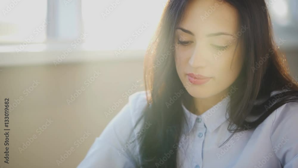 Enjoy beautiful face of young woman in rays of sun. Enjoy beautiful face of young woman in rays of sun.