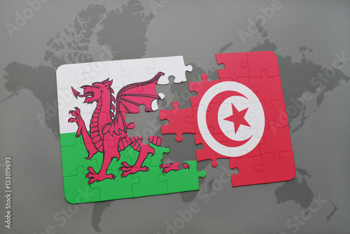 puzzle with the national flag of wales and tunisia on a world map