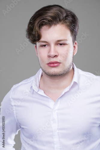 Elegant young handsome man in white shirt
