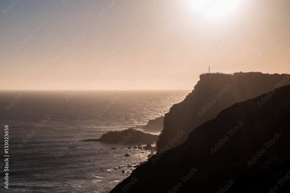 Portugal - Sun setting behind cliffs