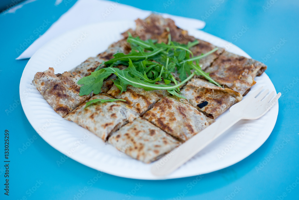 Crepe Cut into Bite-Sized Pieces Served in Paper Plate