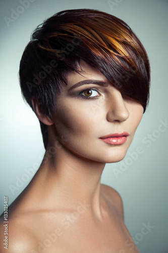 Fashion portrait of a beautiful girl with colored dyed hair, professional short hair coloring. studio shot.