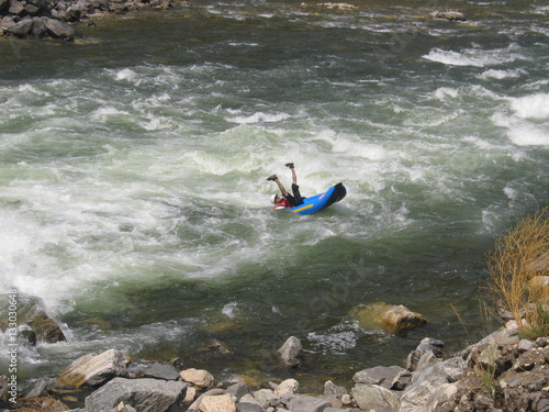 Capsizing spread eagle on the Colorado river while white-water rafting on the waves