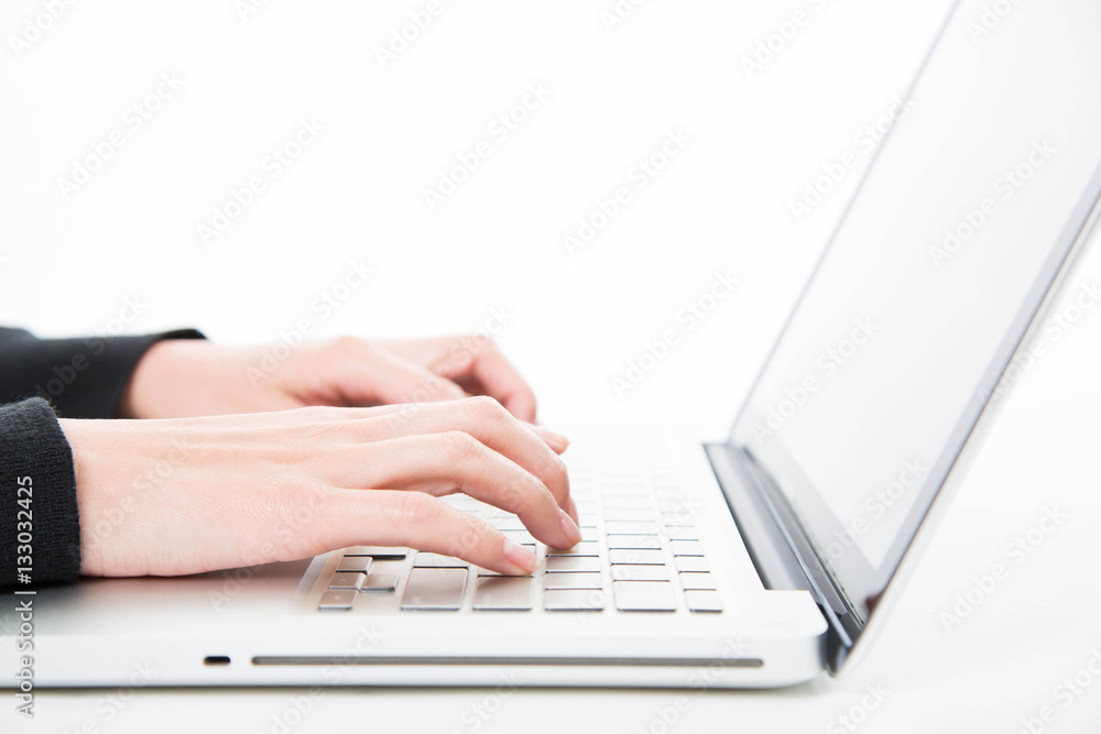 Closeup woman typing on laptop computer Closeup woman typing on laptop computer