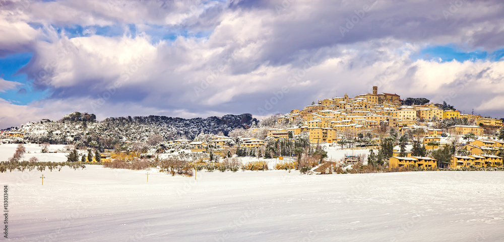 Snow in Tuscany, Casale Marittimo village winter panorama. Italy