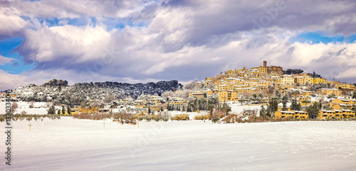 Snow in Tuscany, Casale Marittimo village winter panorama. Italy