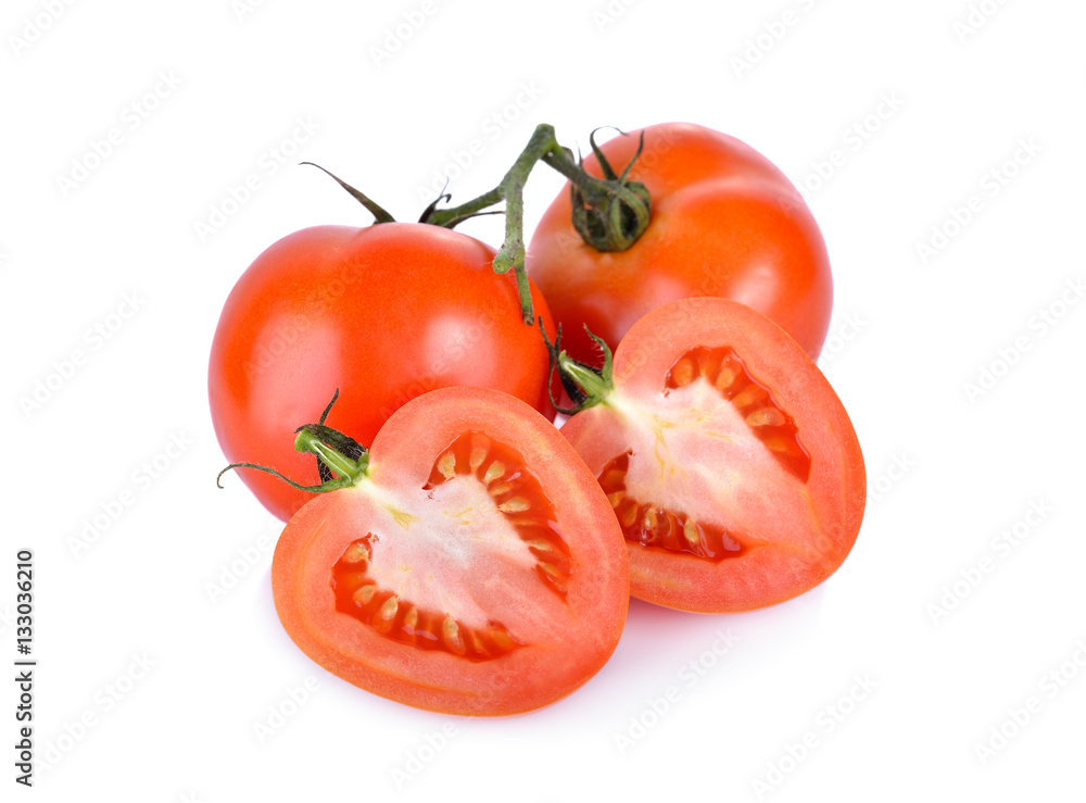whole and half cut fresh tomato with stem on white background whole and half cut fresh tomato with stem on white background