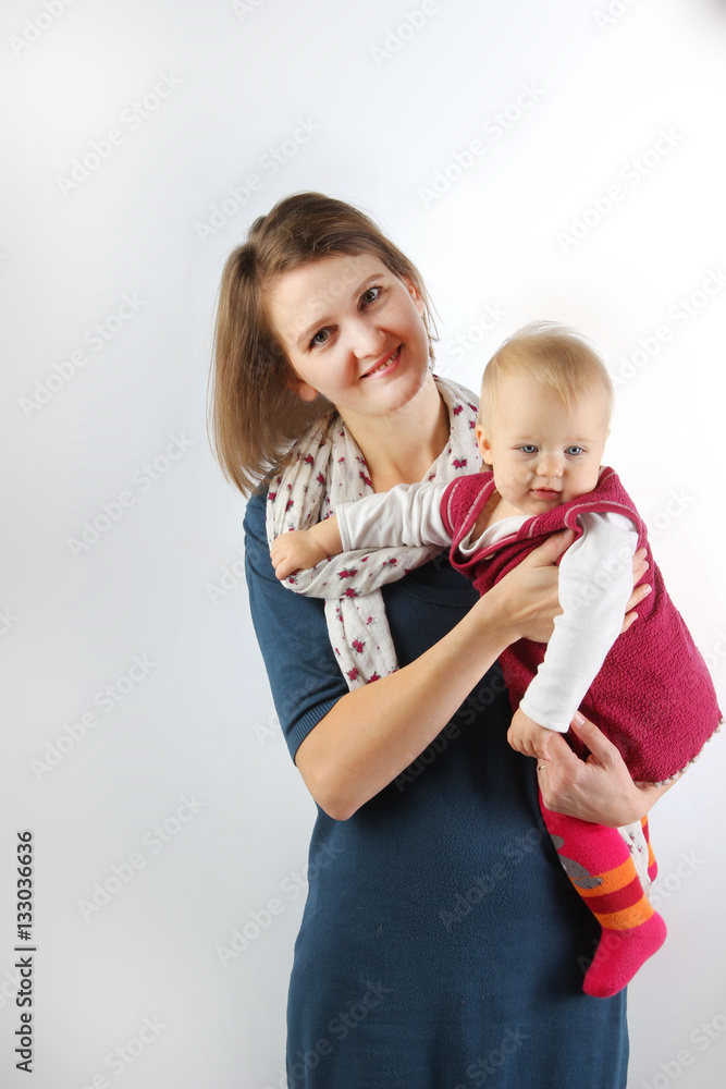 Portrait of a mother carrying her adorable baby girl. Portrait of a mother carrying her adorable baby girl.