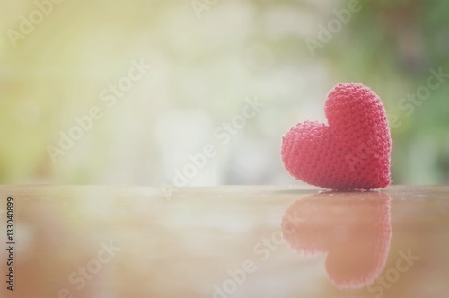 Close up of red heart handmade on wooden table for valentine s day or wedding background