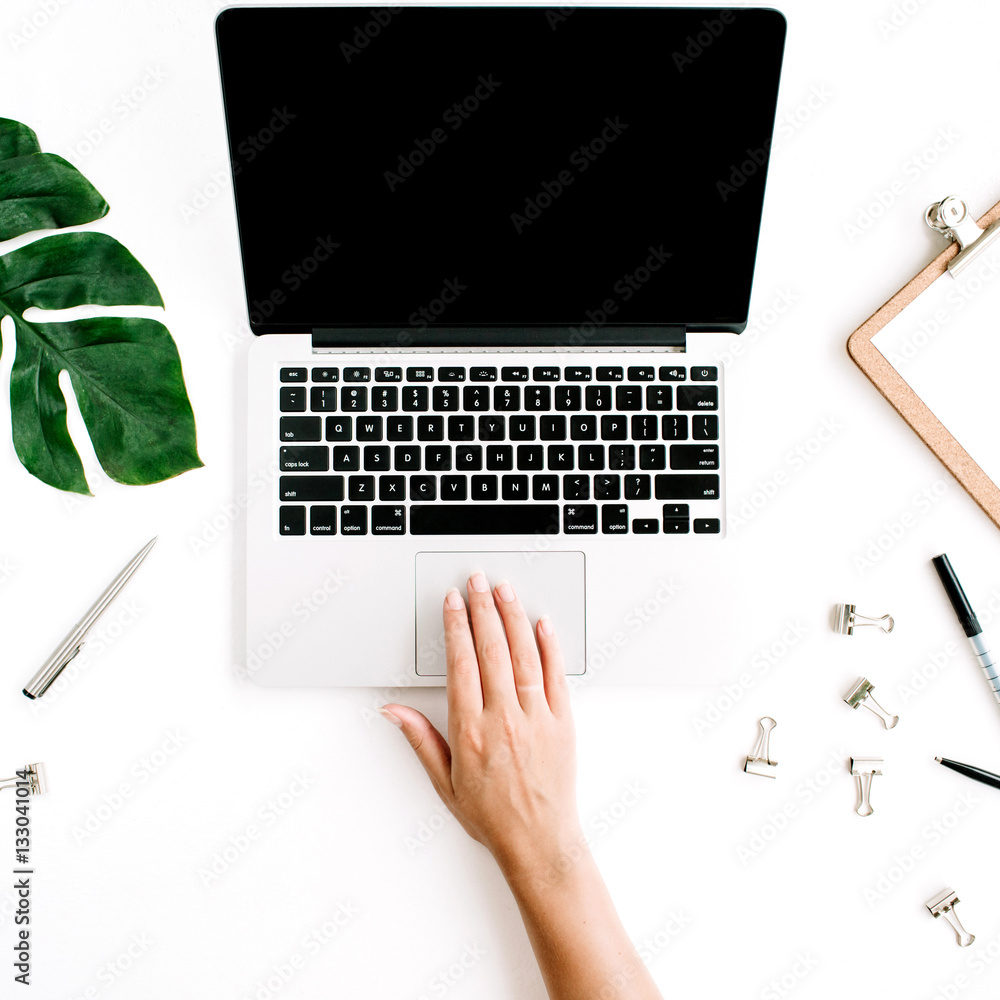 Workspace with woman working on laptop. Flat lay, top view Workspace with woman working on laptop. Flat lay, top view