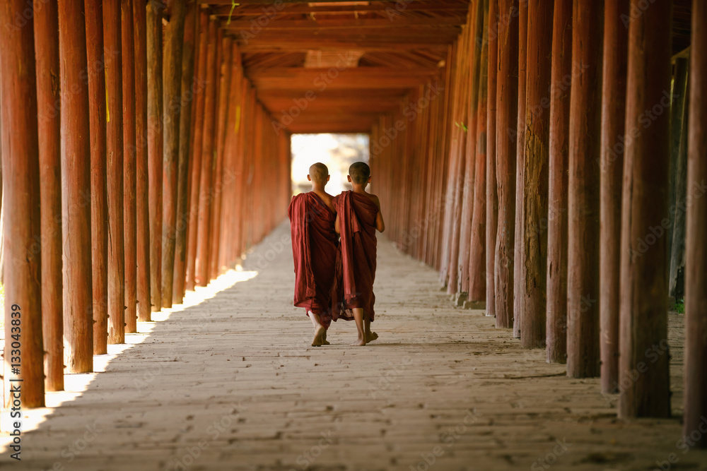 Little monks walking at old temple, Salay Bagan Myanmar