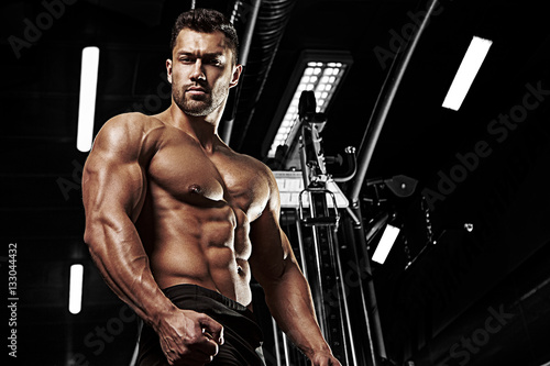 Bodybuilder posing in the gym