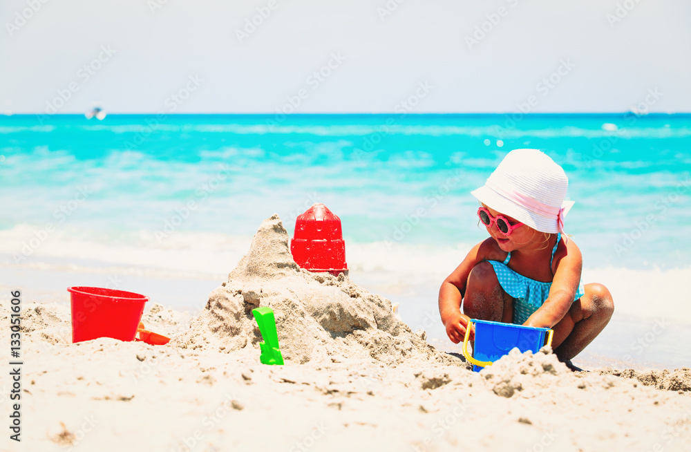 cute little girl play with sand on beach cute little girl play with sand on beach