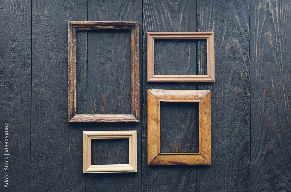 old frames on wooden wall old frames on wooden wall