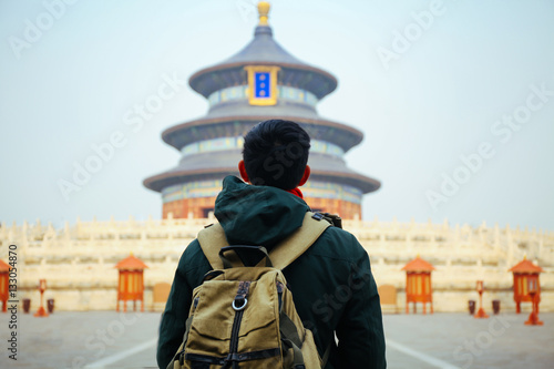 Young traveler standing in front of temple of heaven - in Beijing, China. Asia Travel