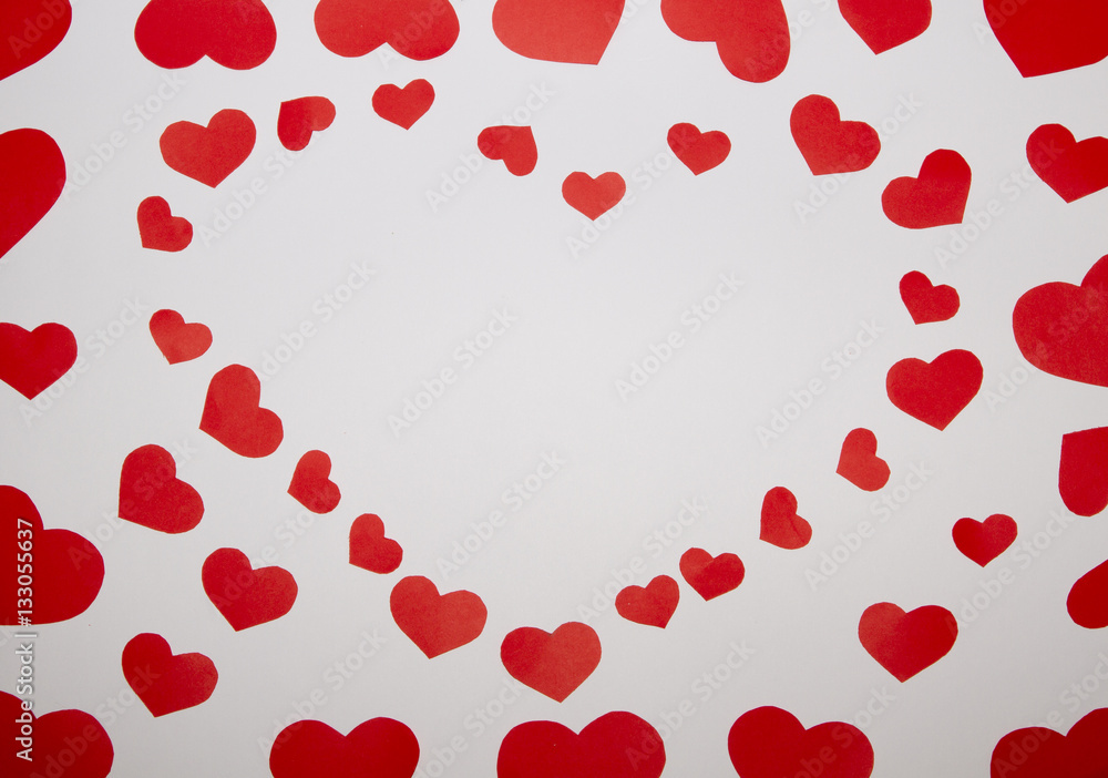 Frame from red paper hearts on white background