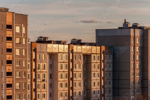 multi-storey city panel apartment house against the background of the evening sky