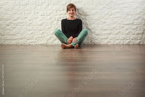 Senior Woman Sitting on Floor