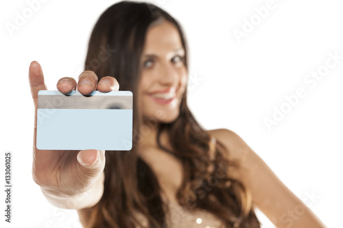 happy young beautiful woman holding a credit card