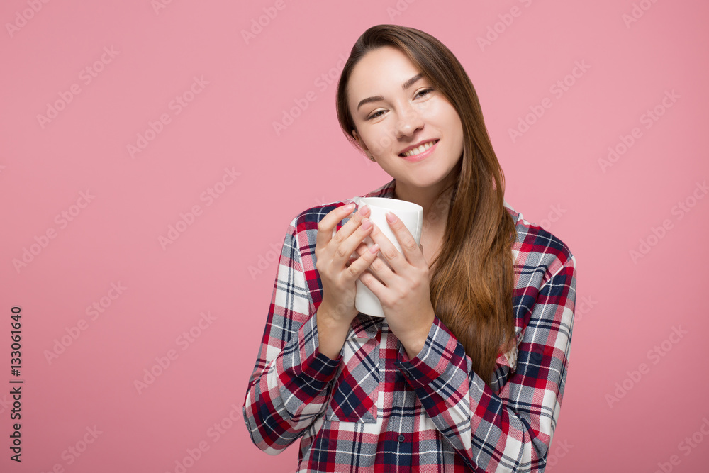 beautiful girl enjoying cup of tea over pink background isolated beautiful girl enjoying cup of tea over pink background isolated