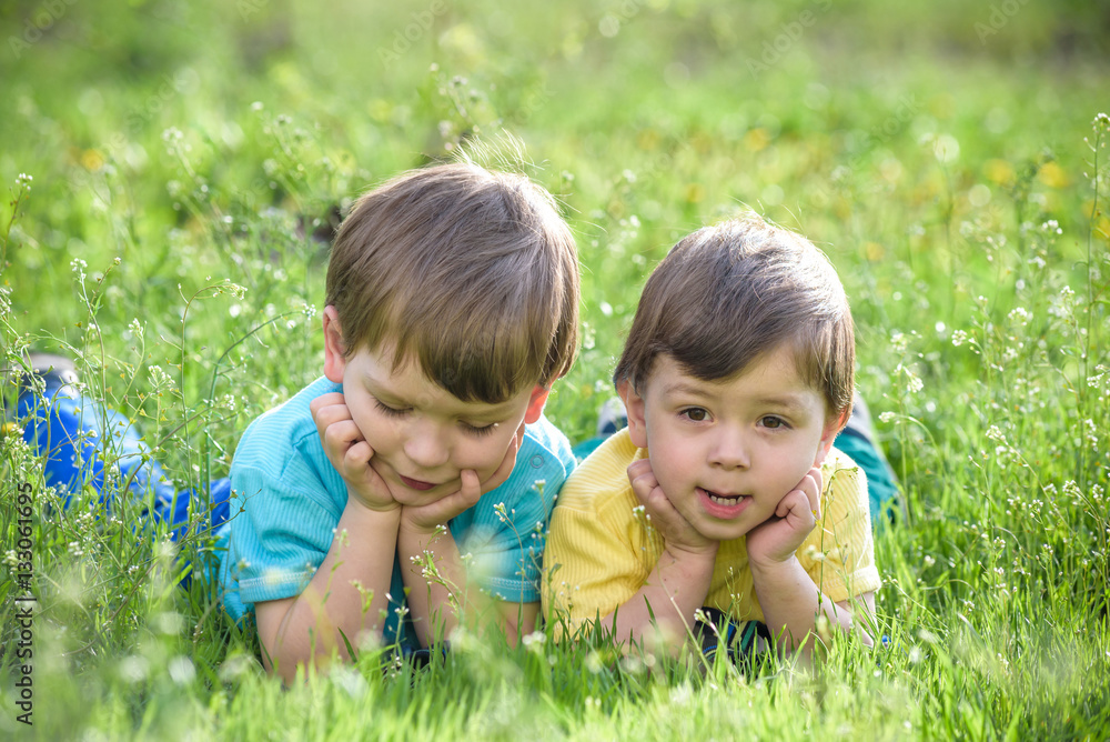 Happy kid enjoying sunny late summer and autumn day in nature on green grass. Happy kid enjoying sunny late summer and autumn day in nature on green grass.